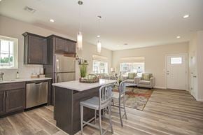 North Babylon apartment for rent - A modern kitchen with a dining table and chairs.