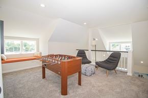 North Babylon apartment for rent - A room with a pool table and a chair.
