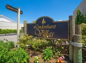 Lindenhurst apartment for rent - a sign for the entrance of indiantown villas in front of a building