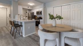 Kissimmee apartment for rent - a kitchen and dining area with a table and chairs