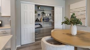 Kissimmee apartment for rent - a dining room with a table and a closet with shelves