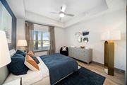 Naples apartment for rent - a bedroom with a bed and a ceiling fan