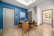 Naples apartment for rent - a dining room with a table and chairs and a blue wall