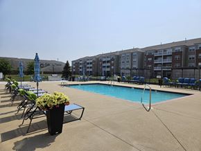 Merrillville apartment for rent - Pool With Relaxing Chairs at Vita on Grant, Merrillville Indiana