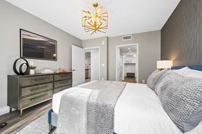 Irvine apartment for rent - a bedroom with a large bed and a dresser