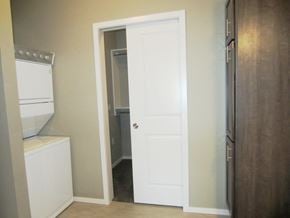 Mitchell apartment for rent - a closet with a white door and a washer and dryer