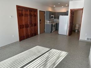 Mitchell apartment for rent - a kitchen and a living room with a refrigerator and a sink