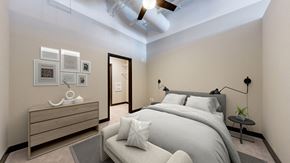 Minneapolis apartment for rent - a bedroom with a large bed and a ceiling fan