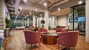 Minneapolis apartment for rent - a lounge area with chairs and tables in a lobby