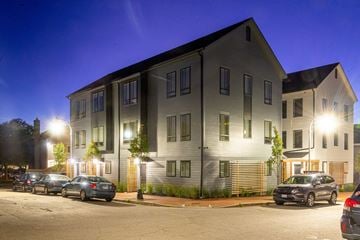 Portland apartment for rent - an apartment building with cars parked in front of it at night