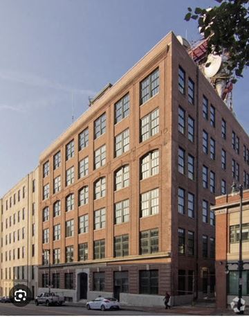 Portland apartment for rent - a large brick building on the side of a street