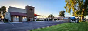 Glendale apartment for rent - Lush green lawn in front of the leasing office at sunrise
