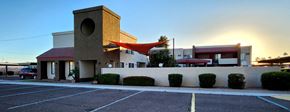 Glendale apartment for rent - Leasing office with a red awning at sunrise