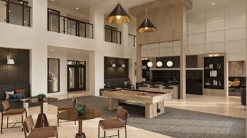 Fort Lauderdale apartment for rent - A modern living room with a pool table and a bar area.