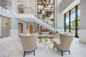 Yonkers apartment for rent - Lobby with Two beige chairs at Hudson Piers, Yonkers, NY 10701