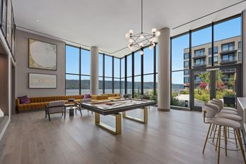 Modern living room with a large table and chairs.