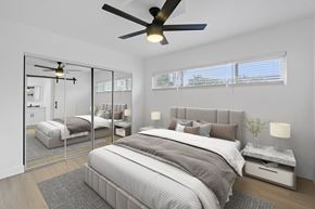Torrance apartment for rent - A bedroom with a large bed and a ceiling fan.