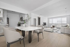 Torrance apartment for rent - A modern dining room with a white table and chairs.