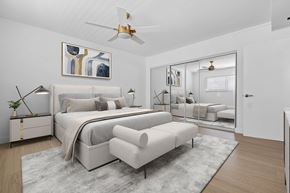 Torrance apartment for rent - A bedroom with a large bed and a ceiling fan.