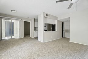 Raleigh apartment for rent - A spacious living room with a ceiling fan and carpeted floor. at Anson at North Hills, Raleigh
