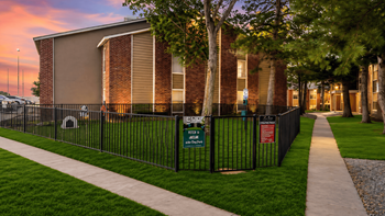 Gated pet play area with memorial signage