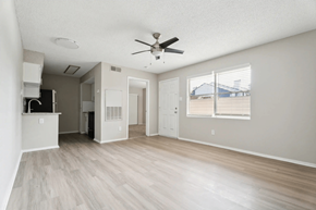 Raleigh apartment for rent - A spacious room with a ceiling fan and light fixture. at Anson at North Hills, Raleigh