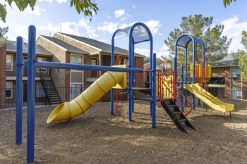 Colorful playground with tube slide and climbing features