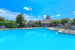 Arlington apartment for rent - A large swimming pool with a depth of 3 feet 6 inches at Addison Park Apartments in Arlington, TX.