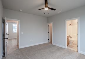 Farmington triplex for rent - A spacious room with a ceiling fan and carpeted floor at Cedar Crest Apartments, Farmington