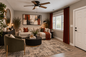 Jacksonville apartment for rent - A living room with a brown chair, a white couch, and a painting on the wall.