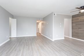 Jacksonville apartment for rent - A spacious room with light wood flooring at Liberty Crossing, North Carolina, 28540