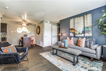Cedar Hill apartment for rent - A living room with a black chair and a grey couch.