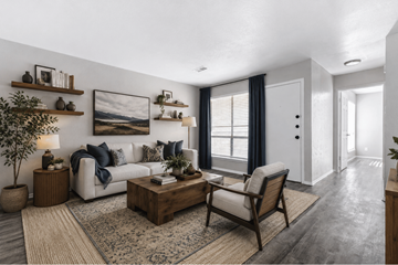 Sherman apartment for rent - A living room with a white couch, a wooden coffee table, and a large painting on the wall.