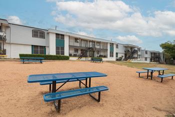 Play area with picnic tables