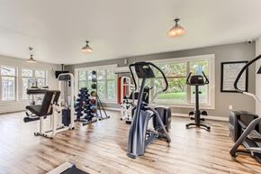 Fairview apartment for rent - Fairview OR Apartments - Lodges at Lake Salish - Resident Fitness Center WIth Ellipticals, Handweights, and Various Other Exercise Machines and Equipment