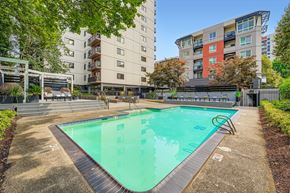 Portland apartment for rent - A swimming pool surrounded by apartment buildings.