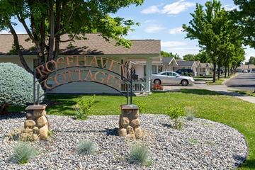 Walla Walla triplex for rent - a sign for the rockwell cottage entrance in front of a house