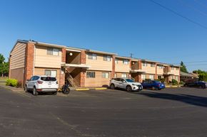 Walla Walla apartment for rent - a large apartment building with cars parked in front of it