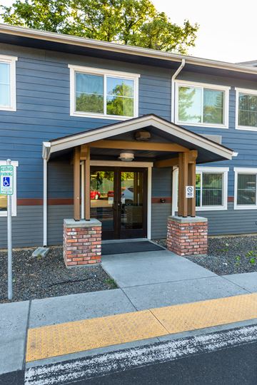Walla Walla apartment for rent - the front entrance of a blue house with a porch