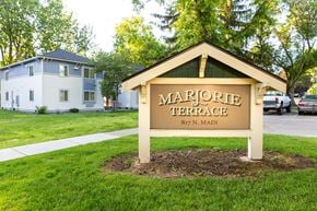 Walla Walla apartment for rent - a sign formarore terrace in front of a house