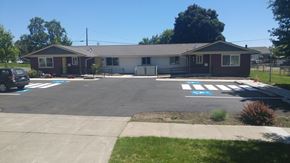 Walla Walla triplex for rent - an empty parking lot in front of a house