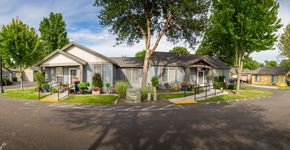 College Place triplex for rent - a house with a driveway and a street in front of it