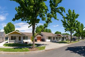 Walla Walla triplex for rent - a row of houses in a neighborhood with trees