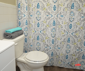 Memphis apartment for rent - a bathroom with a toilet and a shower curtain