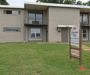 Memphis apartment for rent - a building with a sign in front of it