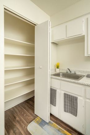 Tucson apartment for rent - A kitchen with white cabinets and a sink.