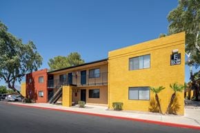 Tucson apartment for rent - A yellow building with a sign that reads 257-764 and 157-164.