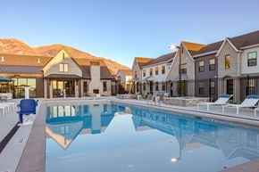 Highland townhouse for rent - A large swimming pool in front of a resort.