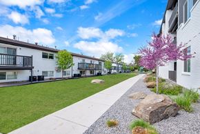 Ogden apartment for rent - the preserve at ballantyne commons apartment community walkway with trees and houses