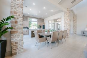 Saratoga Springs apartment for rent - a dining room with a table and chairs in a large room at Aldara Apartments in Saratoga Springs, Utah